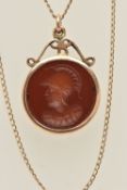 A YELLOW METAL INTAGLIO NECKLACE, a brown paste Centurian intaglio, mounted in yellow metal,