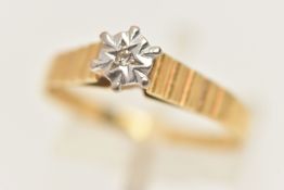 AN 18CT GOLD DIAMOND SINGLE STONE RING, set with a single cut diamond, within an illusion style