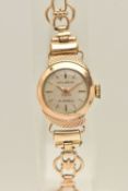 A LADIES 9CT GOLD 'ACCURIST' WRISTWATCH, manual wind, round silvered dial signed 'Accurist', baton