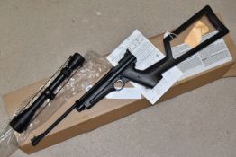 A BOXED CROSMAN CO2 POWERED SINGLE SHOT PELLET AIR GUN IN BLACK PLASTIC , serial number B21