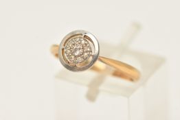 A DIAMOND TARGET RING, a white metal circular mount, set with a principal old cut diamond and a