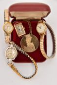 FOUR LADIES WRISTWATCHES AND A BOXED PENDANT WITH CHAIN, to include a ladies yellow metal manual