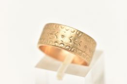 A 9CT GOLD BAND RING, a wide yellow gold band with worn etched floral detail, approximate width 8mm,