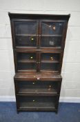 AN EARLY 20TH CENTURY OAK ELASTIC WATERFALL BOOKCASE, fitted with two sets of double doors, and
