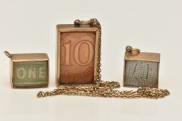 THREE 9CT GOLD BANKNOTE CHARMS AND ONE CHAIN, to include two small One Pound banknote charms in