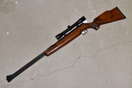 A WEIHRACH HW 77 .22 CAL, 5.5mm AIR RIFLE, serial number 1008111, with under lever action, beech