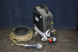 A PERFORMANCE POWER SIX LITRE AIR COMPRESSOR, with a long pipe and tyre inflator gauge, PAT pass and
