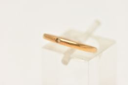 A 22CT GOLD BAND RING, a thin polished band ring set with a single old cut diamond, approximate band