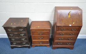 A REPRODUCTION MAHOGANY BUREAU, the fall front door enclosing a fitted interior, over four