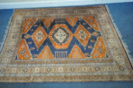 A WOOLEN RECTANGULAR RUG, with repeating geometric patterns, surrounded by a multi-strap border,