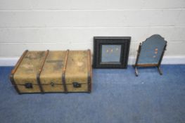 A CANVASS TRAVELING TRUNK, with wooden banding, twin leather handles, and a removable insert,
