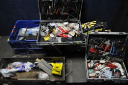 AN AMMO CRATE, A CARDBOARD AND PLASTIC BOX, AND TWO BRIEFCASES, containing a selection of tools,