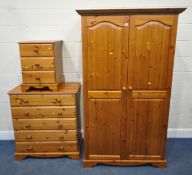A MODERN PINE BEDROOM SUITE, comprising a double door wardrobe, width 110cm x depth 56cm x height