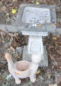 A MODERN COMPOSITE BIRD BATH, with a square bowl, the tapered support with foliate details, on a