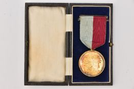 A CASED MASONIC 'HONORABLE TESTIMONIAL CHARITY AND BENEVOLENCE' MEDAL, medal encased in glass,
