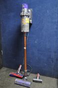 A DYSON CYCLONE V10 ABSOLUTE CORDLESS VACUUM CLEANER, with two spare accessories, condition