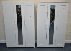 A PAIR OF IKEA TRIPLE DOOR WARDROBES, the central door being mirrored, width 117cm x depth 57cm x