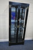 AN EBONISED ORIENTAL DISPLAY CABINET, with double glass doors, enclosing four glass shelves, width