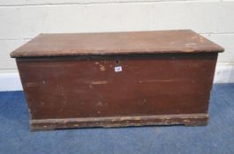 A STAINED PINE STORAGE CHEST, with twin metal handles, the hinged lid enclosing a smaller storage