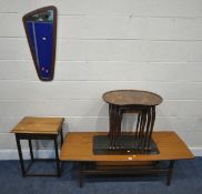 A MID-CENTURY TEAK COFFEE TABLE, with a smoked glass insert, raised on tapered legs, united by an