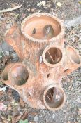 A TERRACOTTA FAUX BOIS STYLE STRAWBERRY PLANTER, with nine assorted spouts, height 64cm, condition