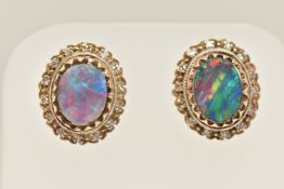 A PAIR OF YELLOW METAL GEM SET EARRINGS, oval opal doublets, prong set in yellow metal with a