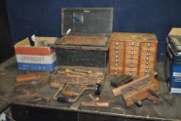 A WOODEN BOX AND A COLLECTORS CABINET CONTAINING CARPENTRY TOOLS, including a D.Kimberley and Sons
