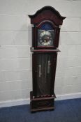 A REPRODUCTION MAHOGANY LONGCASE CLOCK, the arched door enclosing an 11 inch brassed dial, depicting
