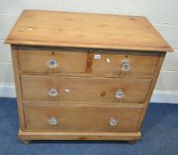 A 19TH CENTURY PINE CHEST OF TWO SHORT OVER TWO LONG GRADUATED DRAWERS, raised on bun feet, width