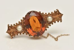 A YELLOW METAL CITRINE AND PEARL BROOCH, set with a central oval cut Citrine, approximately 18.1mm x