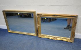 TWO RECTANGULAR GILT WOOD BEVELLED EDGE WALL MIRRORS, the smaller mirror with scrolled and foliate