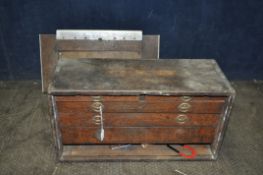 AN OAK ENGINEERS TOOL BOX, with a removable door encloses five drawers, that storing various tools