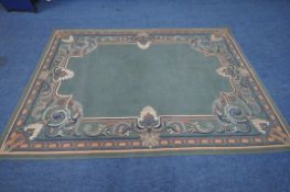 A GREEN GROUND RECTANGULAR RUG, with scrolled and foliate patterns, 292cm x 200cm, condition report: