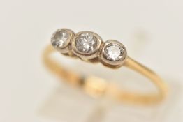 A YELLOW METAL THREE STONE DIAMOND RING, old cut diamonds in a collect setting, estimated total