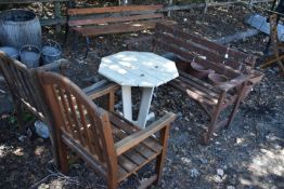 A FOUR PIECE MATCHED STAINED TEAK GARDEN SET, to include a bench, length 28cm, two armchairs and