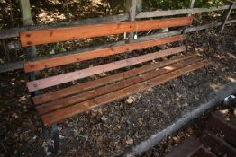 A WROUGHT IRON STRAPWORK BENCH, with pine slats, length 185cm, condition report: solid frame, some