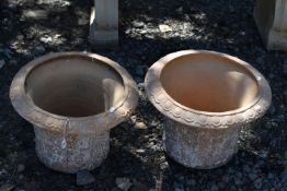 A PAIR OF TERRACOTTA PLANT POTS, with a moulded design to the side, 45cm x height 33cm, condition