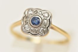 A SAPPHIRE AND DIAMOND CLUSTER RING, a square form white metal mount, bezel set with a principal