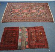 A PINK GROUND RECTANGULAR WOOLLEN RUG, with repeating geometric patterns, surrounded by a multi-