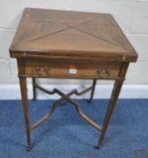 AN EDWARDIAN MAHOGANY ENVELOPE CARD TABLE, the four fold over leaves enclosing a green baize and
