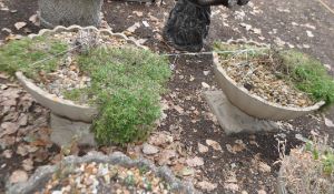 A PAIR OF LARGE CONCRETE GARDEN PLANTERS with a fluted bowl and foliate detail to base, both 78cm in