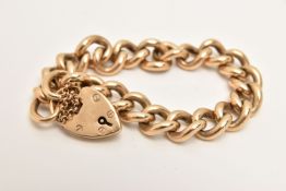 A YELLOW METAL CURB LINK BRACELET, solid curb link bracelet, fitted with a heart padlock clasp, with