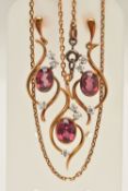 AN 18CT GOLD 'TOM PAYNE' EARRING AND NECKLACE SET, an oval cut garnet, bezel set in yellow gold with