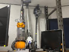 A DYSON DC25 BALL ALL FLOORS UPRIGHT VACUUM CLEANER, a Dyson cordless vacuum cleaner with wall
