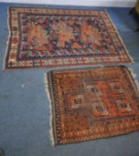 A BLUE GROUND RECTANGULAR WOOLLEN RUG, with repeating geometric patterns, surrounded by a multi-