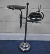AN ART DECO CHROME SMOKERS STAND, with a circular surface, an ashtray and a match box holder, raised