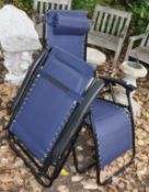 A PAIR OF METAL FRAMED FOLDING SUN LOUNGERS with leg support