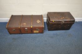 A CANVAS TRAVELING TRUNK, with wooden banding and twin leather handles, width 92cm x depth 55cm x