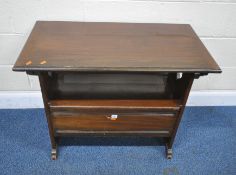 AN EARLY 20TH CENTURY MAHOGANY MONKS BENCH, with a sliding and tilting surface, two armrests with