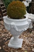 A LARGE PAINTED CONCRETE GARDEN URN with foliate detail, four masks to bowl that's joined by
